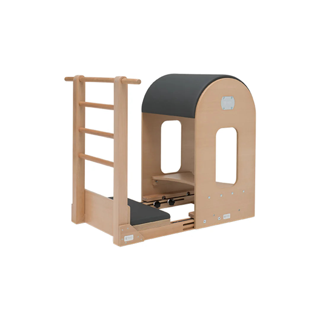 BASI Systems Ladder Barrel with adjustable curved cushion and standing platform for Pilates exercises