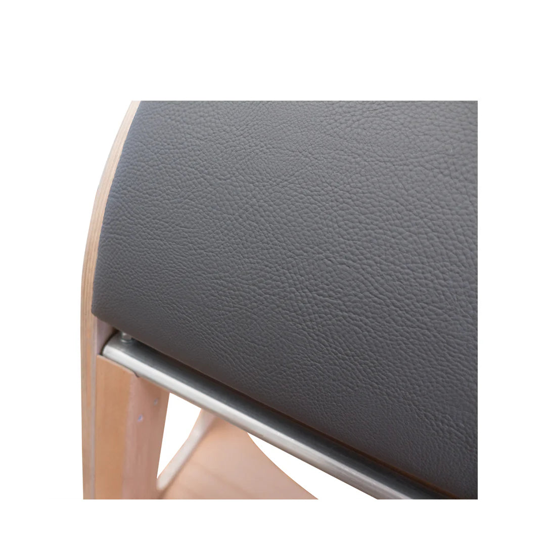 BASI Systems Ladder Barrel with adjustable curved cushion and standing platform for Pilates exercises