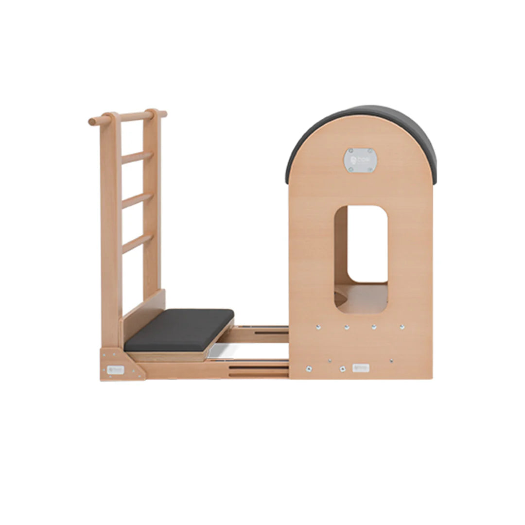 BASI Systems Ladder Barrel with adjustable curved cushion and standing platform for Pilates exercises