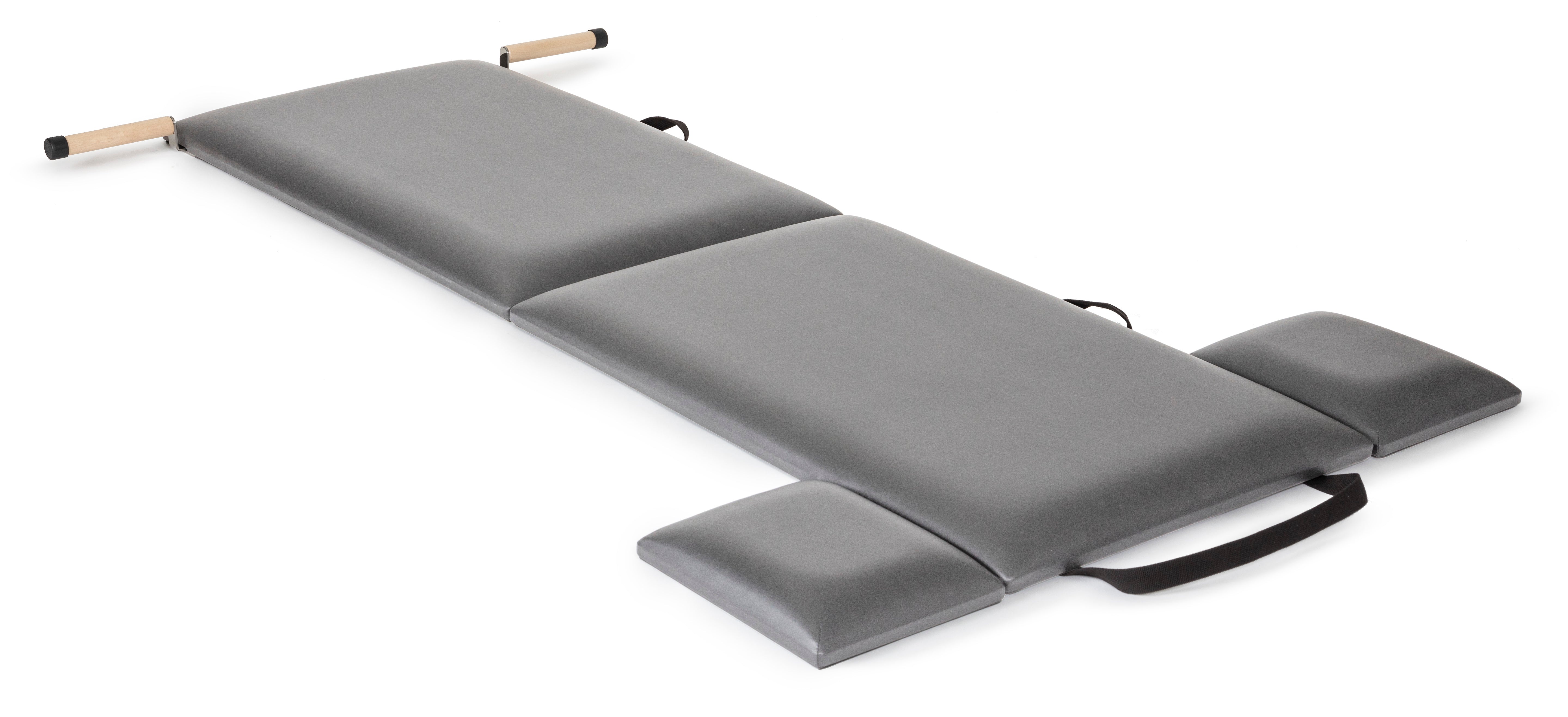 A gray and black folding exercise mat, designed for workouts and easy storage.