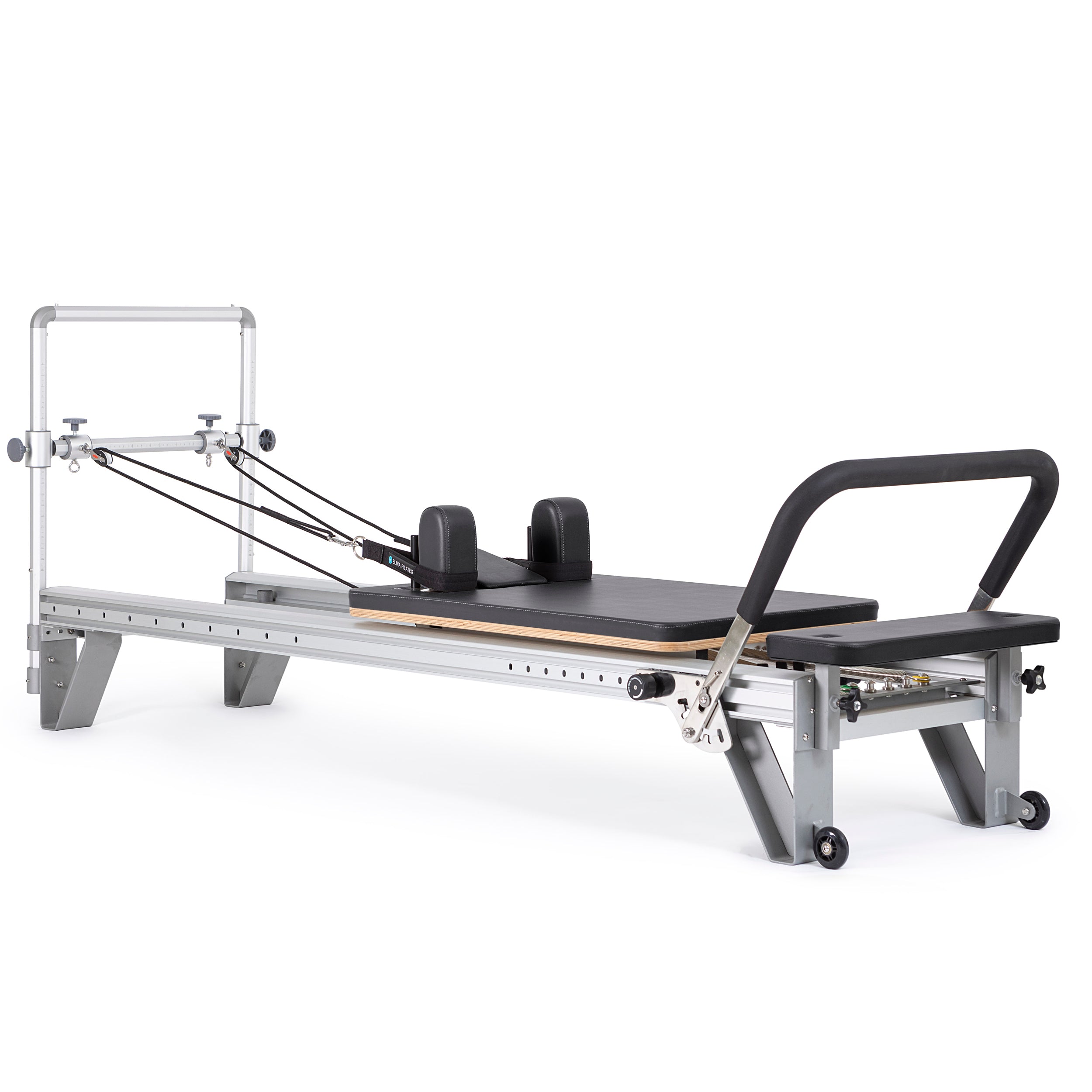 Pilates reformer with a black seat and white frame, featuring adjustable components for versatile training and comfort.