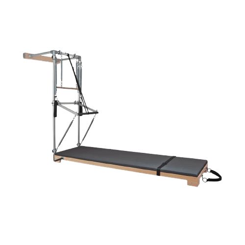 BASI Systems Wall Tower with cushioned mat, metal frame, springs, straps, and wooden base for Pilates exercises.