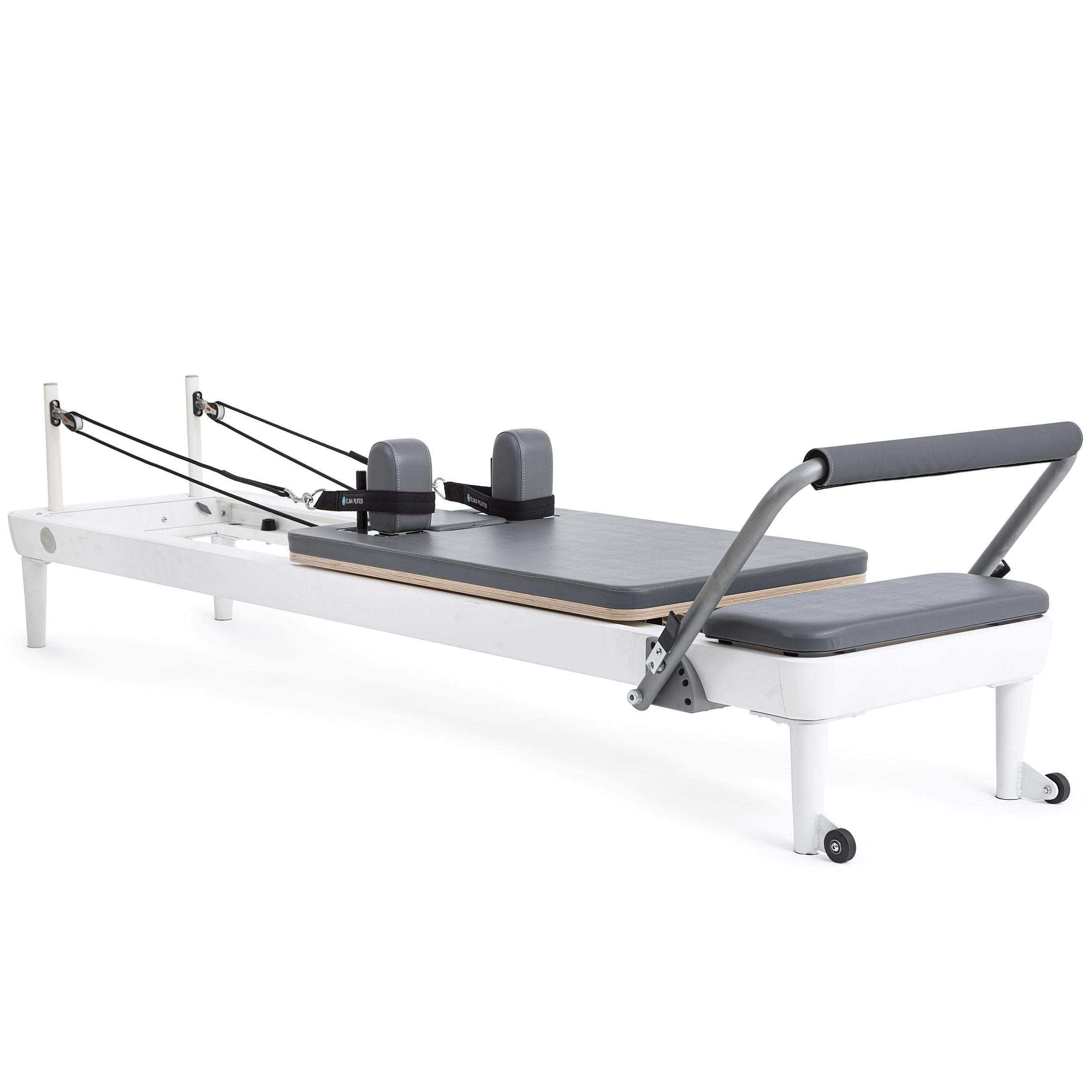 A pilates reformer featuring a padded seat and adjustable footrest for various exercises.