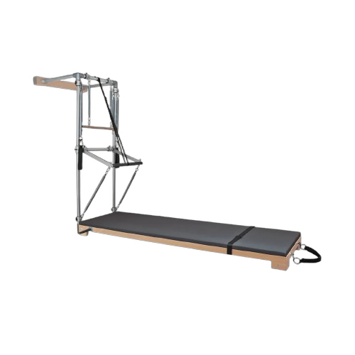BASI Systems Wall Tower with cushioned mat, metal frame, springs, straps, and wooden base for Pilates exercises