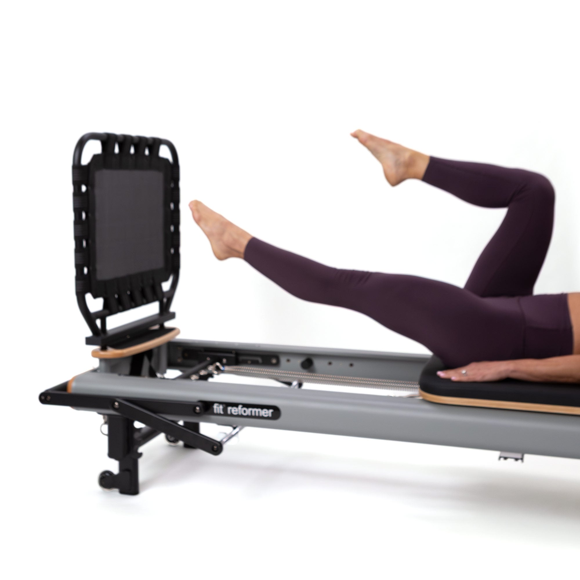 fit Reformer with Rebounder Jump Board in use, detail