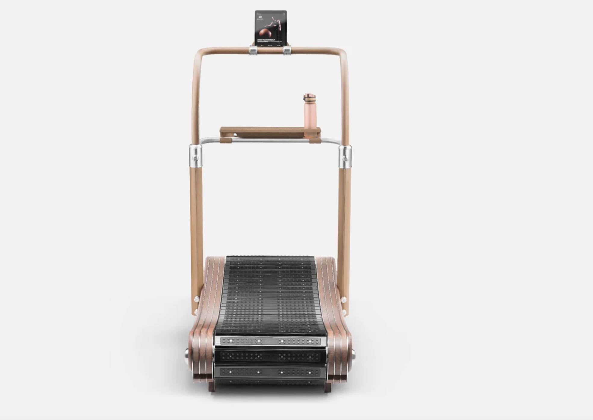 The PENT. IRENA™ luxury curved manual treadmill featuring elegant stainless steel, bronze, and natural wood design, ideal for premium home, hotel, or yacht gyms.