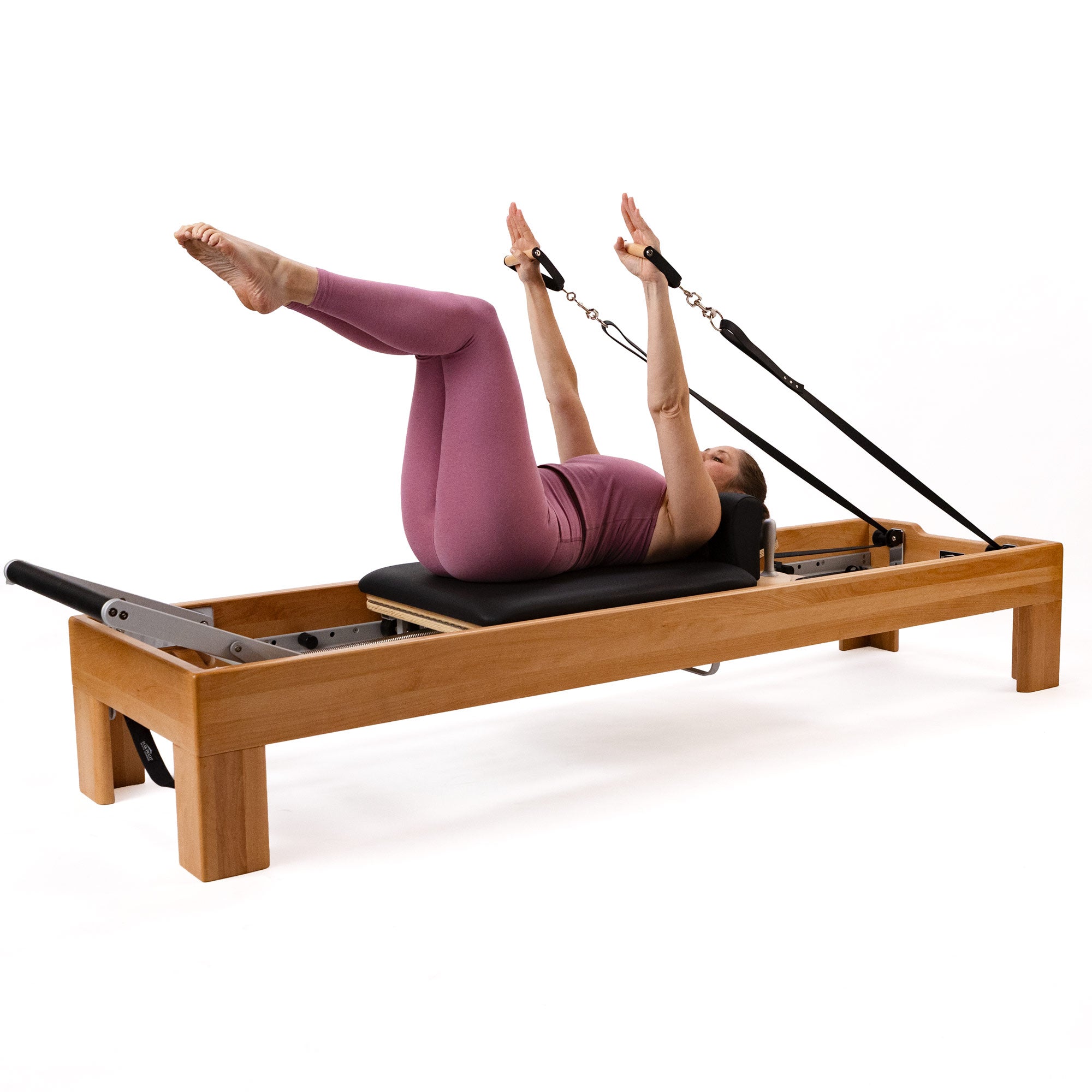 Artistry Reformer, beech finish, vegan straps, in use