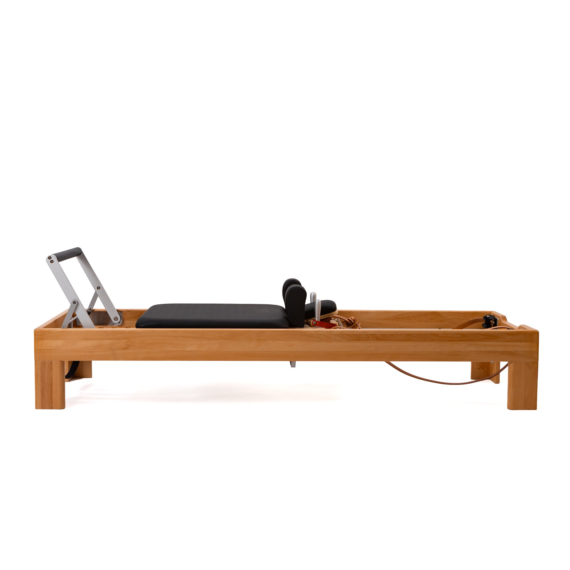 Artistry Reformer, beech finish, leather straps, side view