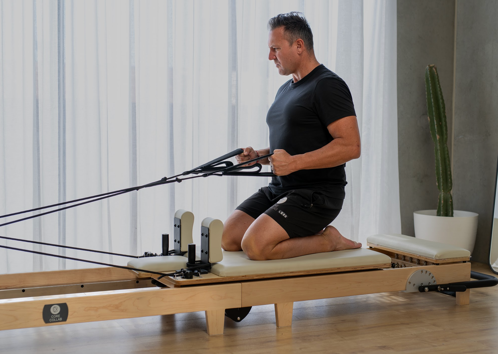 pacious-studio-showcasing-the-core-collab-eco-foldable-pilates-reformer-for-a-professional-workout-experience.